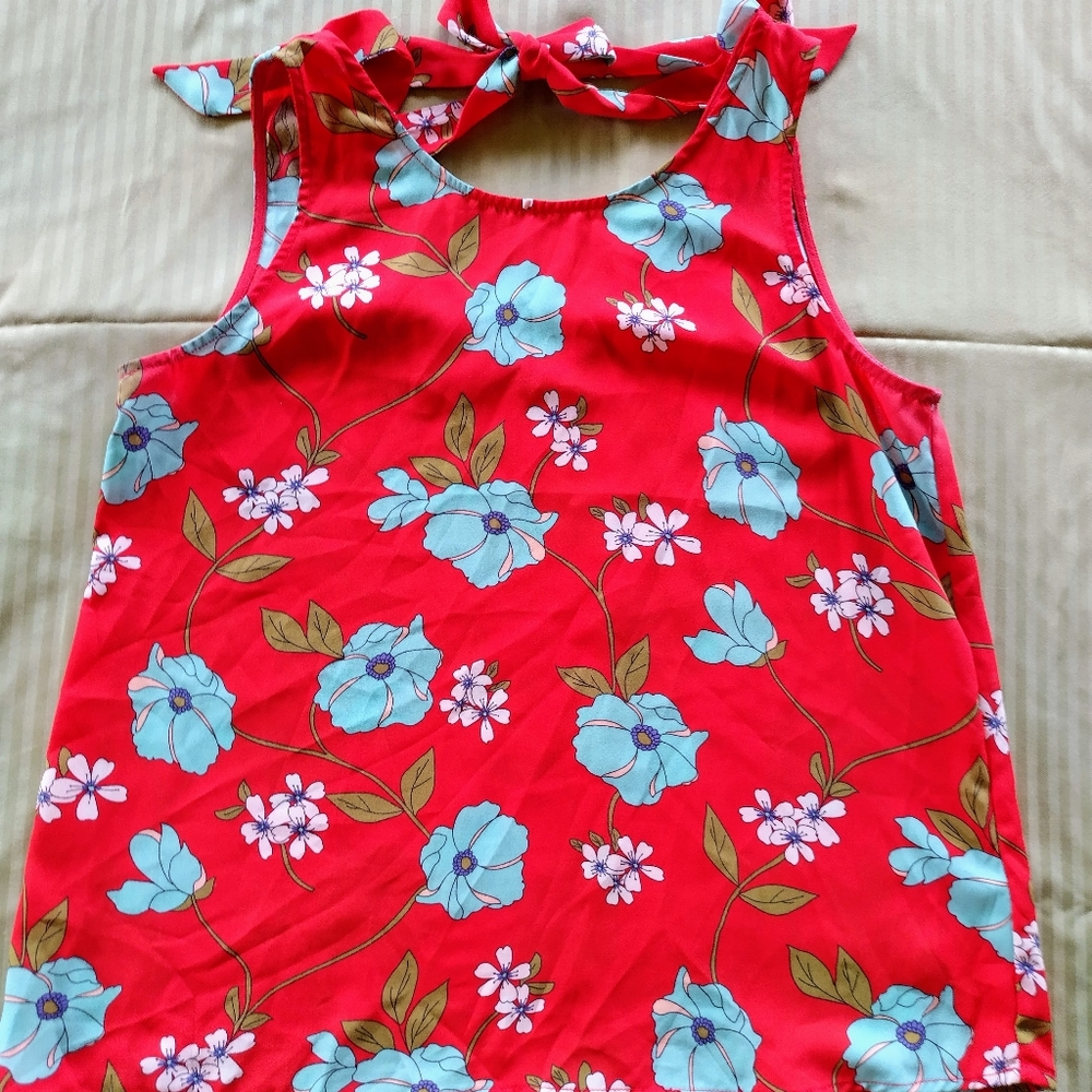 Red floral sleeveless blouse w/ tie neck